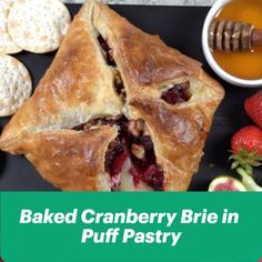 baked cranberry brie in puff pastry with fruit and honey on the side