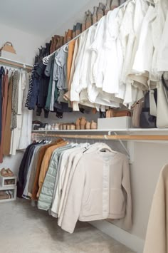 a closet filled with lots of clothes and shoes