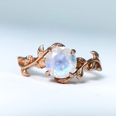 "This vintage moonstone ring is proving a phrase true which is \"Artistry meets imagination.\" The modern finishing of 14k rose gold plating over sterling silver and quality of Natural moon stone with timeless design give a touch of glamour fit no matter whatever the occasion is. The Attract ring features an eye-catching and elegant round-cut Moonstone crystal with vine leaves laid on a delicate finish band. Wearing this unique ring makes women elegant. It is a one-of-kind piece just like the pe Rose Gold Moonstone Ring, Twig Engagement Ring, Vine Leaves, Moonstone Crystal, Wedding Rings Vintage, Healing Jewelry, Unique Ring, Moonstone Ring, Multi Stone Ring