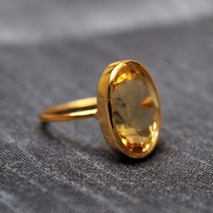 Oval Citrine Gemstone Ring, Oval Citrine Amber Rings, Oval Amber Citrine Ring, Amber Citrine Oval Ring, Amber Oval Birthstone Ring, Oval Citrine Ring With Polished Finish, Classic Oval Citrine Rings, Faceted Oval Topaz Ring Gift, Yellow Oval Rings With Bezel Setting