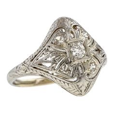 Art Deco Filigree Diamond Ring sold by Doyle & Doyle vintage and antique jewelry boutique. Ornate White Gold Diamond Ring With Rose Cut, Diamond White Filigree Rings Fine Jewelry, Ornate White Gold Rings With Diamond Cut, Ornate White Gold Diamond Ring With Rose Cut Diamonds, Formal Diamond Filigree Ring With Engraving, Formal Engraved Diamond Filigree Ring, Fine Jewelry Filigree Diamond Ring In Diamond White, Heirloom Diamond Ring With Engraving, Heirloom Diamond Ring Engraved