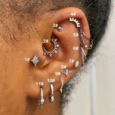 a woman with multiple piercings on her ear