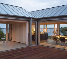 an open patio with sliding glass doors leading to the dining room