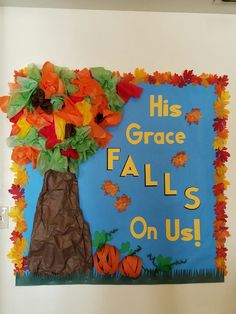 a bulletin board decorated with fall leaves and pumpkins in the shape of a tree that says his grace falls on us