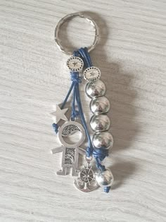 a key chain with charms attached to it