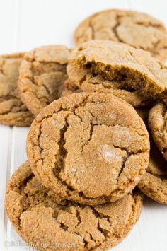 a pile of cookies sitting on top of a white table