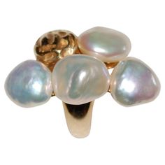 Yvel 18K Gold Sea Baroque Pearls Ring Yvel's signature, handmade 18k yellow gold, polished-finish is combined with a beautiful four baroque pearls and one gold in the shape of a fifth pearl. Each pearl in unique in a different beautiful shades of colors, yellow, pink, silver and lilac. Size of the setting is approximately 35mm x 20mm . Size 6 1/2 Stamped 750, and YVEL hallmark Luxury 14k Gold Pearl Ring, Luxury Gold Pearl Ring With High Luster, Luxury Gold Pearl Ring, Luxury Gold Rings With High Luster, Luxury High Luster Gold Pearl Ring, Luxury High Luster Gold Rings, Silver And Lilac, Pearls Ring, Baroque Pearls