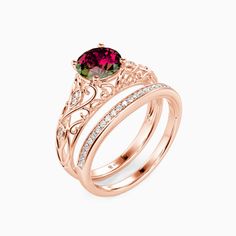 an engagement ring set with a pink tourmaline and white diamonds on the band