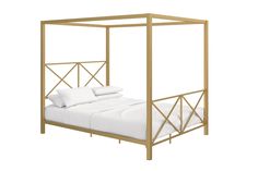 a bed with white sheets and gold frame