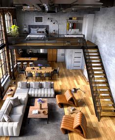 an aerial view of a living room with couches, tables and stairs leading up to the loft