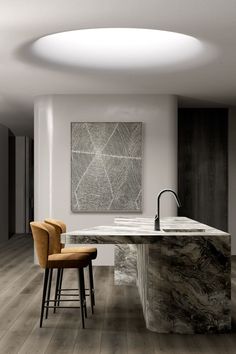 a kitchen with marble counter tops and stools next to a painting on the wall