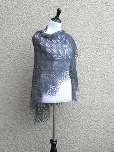 This hand knit shawl is made with a blend of 100% wool.It is very laced and delicate and yet a bit warm.Simple flower ornament adds a romantic look to the shawl.It can be a perfect gift for your mother, sister, wife or friend :)Add some positive and bright colors to your look!You can wear it as a shawl with an elegant dress or as a scarf with a casual outfit.Hand wash and dry flat (or block it if you can). PLEASE NOTE: I'll be happy to knit this shawl for you in any other color. There are 150 di Elegant Knitted Shawl Scarf, Elegant Hand Knitted Shawl Scarf, Elegant Hand-knitted Shawl Scarf, Elegant Crochet Shawl For Winter, Elegant Gray Shawl For Winter, Knitted Wrap, Shawl Wedding, Bridesmaid Shawl, Hipster Sweater