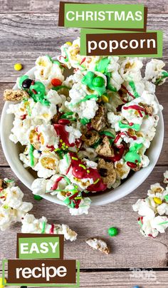 a bowl filled with popcorn covered in green and white sprinkles next to candy