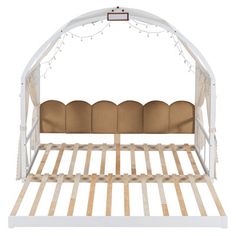 a white bed with wooden slats and string lights