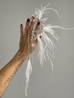 White feather earrings, Boho bridal Ear cuff no piercing, Feather ear cuff chain, Elf ear cuff, White Dragon ear cuff, Angel earrings This ostrich feather ear cuff white color will definitely make your outfit so wild! Slip on an ear cuff for a look that will transform your ear immediately!  This is a perfect bridal Boho cuff earring created with  crystal, pearls beads and feathers. Our jewelry design is inspired by nature and made with the highest attention to detail and quality Be beautiful and unique with Vetochka4U jewelry! Decor - all length 13 cm = 5 inch Length ear cuff 6 cm = 2,3 inch Chain 8 cm = 3,14 inch Ear cuff earrings are very comfortable and easy to wear. Price is for a single piece ear cuff + earring. More color Ready to ship in 1-3 business days.  All products will be ship Ear Wrap Cuff, Dragon Ear Cuffs, Feather Ear Cuff, Ear Cuff Chain, Elf Ear, Elf Ear Cuff, Ear Cuff Jewelry, Boho Cuff, Angel Earrings