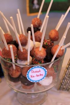 a bowl filled with donuts and marshmallows on top of a table