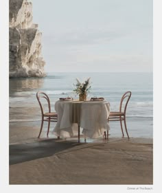 a table set for two on the beach