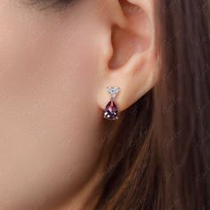 These darling teardrop Alexandrite stud earrings are sure to become your new favorite go-to pair. Made from sterling silver with change color Alexandrite gemstones and cubic zirconia accents, they add a subtle yet stunning pop to any outfit. The teardrop cut Alexandrite stones capture light and transform from emerald green to purplish red depending on the setting, offering double the style for one reasonable price. Slip them on for an instant upgrade, whether you're heading to work or out for a Fine Jewelry Teardrop Earrings In Cubic Zirconia, Pear-shaped Gemstone Teardrop Earrings For Anniversary, Sterling Silver Teardrop Earrings With Sparkling Stones, Sterling Silver Teardrop Earrings With Diamond Accents, Gift Teardrop Earrings With Diamond Accents, Sterling Silver Teardrop Earrings With Sparkling Stones For Gift, Pear-shaped Cubic Zirconia Gemstone Earrings, Gift Sterling Silver Teardrop Earrings With Sparkling Stones, Diamond Teardrop Earrings With Gemstone Accents