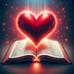 an open book in the shape of a heart with bright lights coming out of it