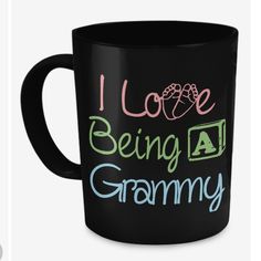 a black coffee mug with i love being a grams written on the front and side