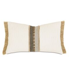 a white and brown pillow with fringes on the front, one side is made out of