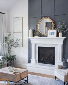 a living room with gray walls and white fireplace mantel in the center, surrounded by furniture