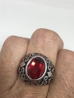 Vintage Red Ruby Glass Mens Ring Stainless Steel Deco design about half an inch Cool Vintage Rock and Roll star men's ring Nice heavy ring, Stainless Steel Unused stock from the 1980's I have an assortment of sizes from 7 - 9 - 10 - 11 - 12 or 13 ONLY. Please add your size to the order in a message and I will send the size you require. If I am out of stock in your size, I will list the ones I have available for replacement. If I am sold out in the sizes you would prefer, I will cancel and refund Retro Red Ring Jewelry, Mens Stainless Steel Rings, Vintage Rock, Vintage Gothic, Mens Ring, White Band, Ring Photos, Men's Ring, Red Ruby