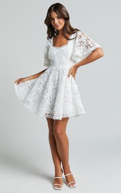 Get ready to turn heads in the Marisole Mini Dress! This stunning A-line flutter sleeve lace dress in white is perfect for any party day or night. The sweetheart neckline and mini length add a flirty touch, while the short sleeves provide just the right amount of coverage. Made from high-quality polyester, this dress is both comfortable and stylish. Whether you're attending a special occasion or simply want to feel fabulous, the Marisole Mini Dress is the perfect choice. Don't wait - make a stat Fancy Short Dresses, Sleeve Lace Dress, Lace Dress With Sleeves, Korean Fashion Dress, White Short Dress, Long Dresses, White Outfits, Lace Fabric, Flutter Sleeve