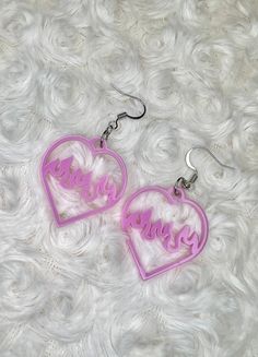 ✨Product Description✨ Bold and beautiful, these earrings nod to the pastel goth look. Perfect for every day wear and with an understated style, these earrings will add a touch of intrigue to any outfit. Personalized Heart Earrings For Party, Personalized Cute Heart Earrings, Trendy Pink Heart Earrings Pierced, Cute Pink Heart Pierced Earrings, Cute Pink Pierced Heart Earrings, Pastel Goth Accessories, Trendy Purple Heart Earrings, Pastel Gothic Accessories, Pink Kawaii Heart Earrings For Valentine's Day