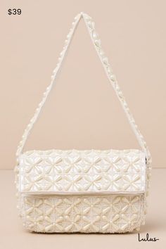 Your going-out look just isn't finished without the Lulus Luxe Perception Ivory Pearl Beaded Mini Shoulder Bag! This stunning little bag packs a big punch, thanks to an allover design of gorgeous faux pearl beads across the rectangular, flat-bottom silhouette. Fold-over top flap has a magnetic closure that opens to reveal a roomy, satin-lined interior with a single sidewall pocket. Flexible shoulder strap completes the look. Lined. Bag Measures 8" Wide, 6" Tall, And 2" Deep. Handle Has A 8. 5" D Cream Rectangular Shoulder Bag With Pearl Handle, Beige Clutch Bag With Pearl Embroidery, Party Shoulder Bag In Cream With Pearl Embroidery, Cream Shoulder Bag With Pearl Embroidery For Party, Chic Cream Bag With Pearl Embroidery, Chic Cream Bags With Pearl Embroidery, Cream Rectangular Bag With Pearl Embroidery, White Shoulder Bag With Pearl Embroidery For Everyday, White Pearl Embroidered Clutch Shoulder Bag