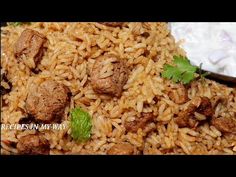 rice with meat and sour cream sauce in a bowl