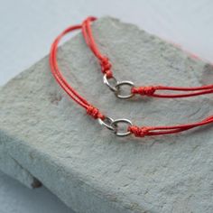 Wear these matching friendship bracelets to remind you of our connection. Know that the bond we share can not be broken. We were meant to be, you and me. The link keeps us connected, the red thread protects us, brings us luck, and reminds us to hold strong to what matters most. Size Fully adjustable, one size fits most. Total bracelet length is 10" or 25cm. Adjustable from 2-5 inches in diameter. Material Waterproof, tarnish resistant, hypoallergenic, surgical grade stainless steel talisman Wate Red Adjustable Friendship Jewelry, Red Adjustable Cord Friendship Jewelry, Red Adjustable Cord Jewelry For Friendship, Matching Friendship Bracelets, Mantra Ring, Mantra Bands, Thread Bracelets, Red Thread, What Matters Most