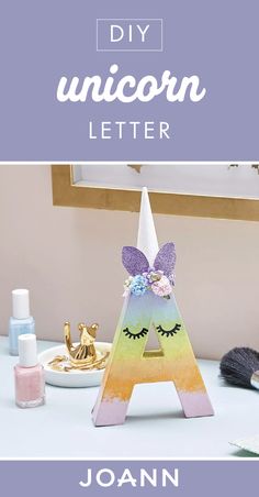 a unicorn letter with the words diy unicorn letter in front of it and an image of