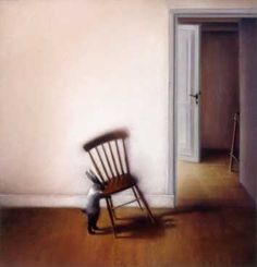 a chair sitting in the corner of a room next to an open door with a cat on it