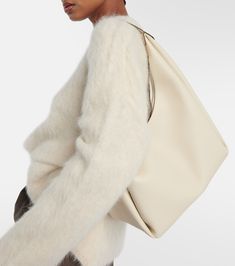 Leather tote bag in white - Toteme | Mytheresa White Leather Pouch Hobo Bag, Neutral Double Handle Shoulder Bag, Neutral Leather Bucket Bag Shaped As Tote, White Hobo Bag With Leather Handles For On-the-go, Beige Textured Leather Hobo Tote Bag, Neutral Leather Shoulder Bag With Double Handle, Versatile White Soft Leather Hobo Bag, Neutral Leather Tote Shoulder Bag, White Leather Bucket Bag For On-the-go