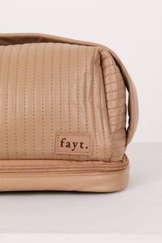 Introducing the latest Fayt makeup bag. The perfect cosmetic bag to carry all your go-to products, brushes and skincare faves. Featuring a zip top with a large capacity inside and handy carry handle on top, as well as a separate brush compartment on the base and a cover to keep all your brushes from transferring. What more could you want from a makeup case! Why you'll love our Makeup Bag: Featuring a cute carry handle and zip top - she is convenient and easy to travel with Unzip the bottom compartment to store even more goodies! Comes with a separate makeup brush storage component Made from a super soft, squishy faux leather fabric and in the cutest coffee colour - we are obsessed! The details: Zip up make-up bag Soft PU Leather Separate brush compartment on the base Handle on top Cute pat Brush Storage, Makeup Brush Storage, Faux Leather Fabric, Coffee Colour, Make Up Bag, Makeup Case, Makeup Brush, Leather Fabric, Zip Top