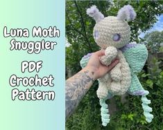 a person holding a stuffed animal in their hand with the caption luna moth snuggler free crochet pattern