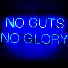 there is a neon sign that says no guts no glory in blue light on the wall