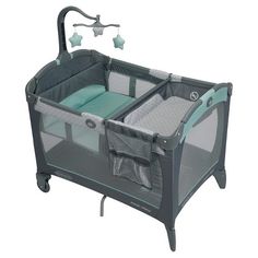 the baby crib has two changing tables and is attached to it's side