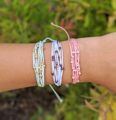 P U R A V I D A B R A C E L E T these pura vida inspired bracelets are made so that you can have a similar bracelet for cheaper! these are durable, so you do not have to worry about the string breaking. these bracelets are waterproof, so you can wear them in the water and are also adjustable, so you do not have to worry about the fit. these bracelets are made extra-long, so that one size can fit all. however, if the ends are too long for your taste, you can simply cut, tie, and burn the ends. ea Purple Tiny Beads Bracelets For Beach, Pink Braided Bracelets With Colorful Beads For Festival, Pink Braided Bracelet With Colorful Beads For Festival, Colorful Beads For Friendship, Trendy Beaded Strand Friendship Bracelets, Resizable Beaded Bracelets For Vacation, Purple Beaded Bracelets With Colorful Beads For Summer, Colorful Beaded Purple Bracelets For Summer, Pink Round Beads Braided Casual Bracelets