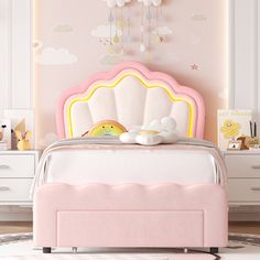 a child's bedroom with pink furniture and clouds painted on the wall behind it