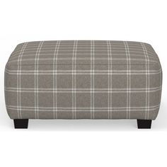 the foot stool is made out of fabric and has a checkered pattern on it