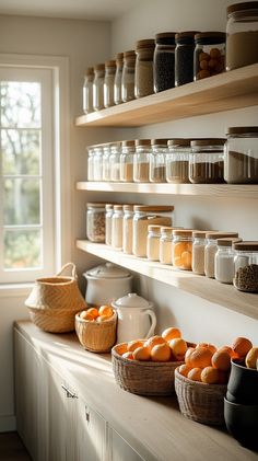 the shelves are filled with jars and oranges