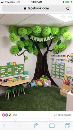 an office decorated with green paper trees