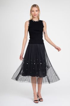 Get ready to dazzle in our Black Pearl Pleated Skirt! This midi skirt features a unique black tulle pleated design and is fully lined for comfort. With ivory pearls scattered all over and an elastic waistband, this versatile skirt is perfect for any occasion. Step out in style with this playful and eye-catching piece. Spring Party Skirt With Pleated Hem, Summer Party Skirt With Pleated Hem, Stretch Midi Pleated Skirt For Party, Stretch Pleated Midi Skirt For Party, Spring Embellished Stretch Skirt, Spring Stretch Embellished Skirt, Party Pleated Midi Tulle Skirt, Party Midi Tulle Pleated Skirt, Pleated Tulle Flared Skirt For Party