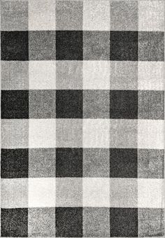 a gray and white checkered rug with black squares on the bottom, in an area that looks like it has been made out of wool