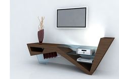 a modern desk with shelves and a tv