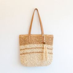 a straw bag hanging on the wall