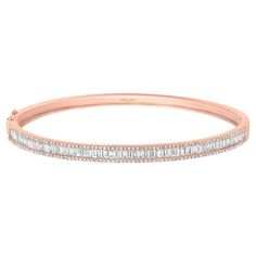 This exquisite bangle is a radiant display of sophistication and luxury. Crafted from lustrous 18kt rose gold, it features a stunning arrangement of baguette-cut diamonds that grace the center, exuding a timeless elegance. The sides of the bangle are adorned with brilliant round diamonds, adding a captivating sparkle to this piece of jewelry. With its combination of pristine white gold and the scintillating diamonds, this bangle embodies a classic and refined aesthetic, making it a truly excepti Rose Gold Bangle Bracelet, Rose Gold Bangle, Refined Aesthetic, Jewelry Accessories Ideas, Baguette Cut Diamond, Accessories Ideas, Diamond Bangle, Baguette Cut, Or Rose