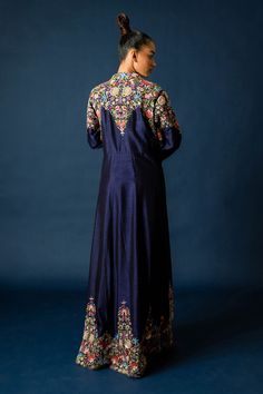 Blue silk long jacket, highlighted with floral and zardozi hand embroidery. Paired with an inner top with all over floral hand embroidery and fringed tassels.
Components: 2
Pattern: Hand Embroidery
Type Of Work: Floral, Zardozi
Neckline: Top: Round Neck
Sleeve Type: Jacket: Full Sleeves
Fabric: Silk
Color: Blue
Other Details: 
Note: Pant worn by the model is not for sale
Occasion: Sangeet,Party - Aza Fashions Designer Raw Silk Nehru Jacket With Floral Embroidery, Cotton Silk Nehru Jacket With Floral Embroidery For Diwali, Silk Nehru Jacket With Zari Work For Reception, Floral Embroidered Chanderi Nehru Jacket, Chanderi Nehru Jacket With Floral Embroidery, Silk Long Sleeve Sherwani For Navratri, Embroidered Cotton Silk Anarkali Set, Designer Floral Embroidered Long Sleeve Anarkali Set, Designer Long Sleeve Anarkali Set With Floral Embroidery